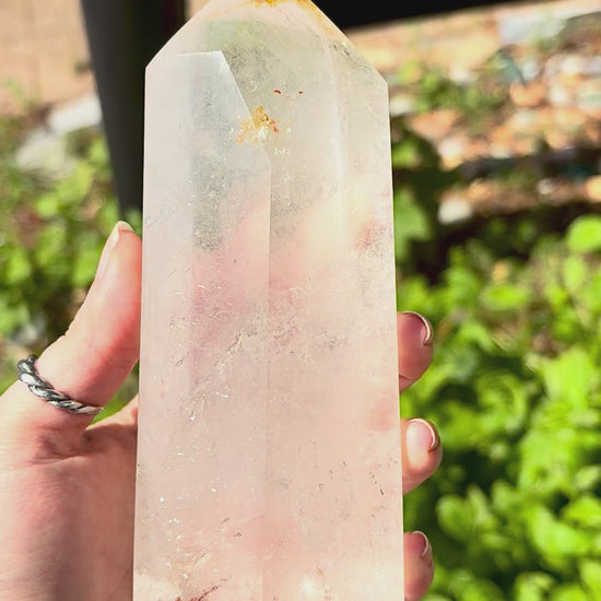 Quartz crystal prism for desk decor with polished finish, clear tones and natural inclusions.
