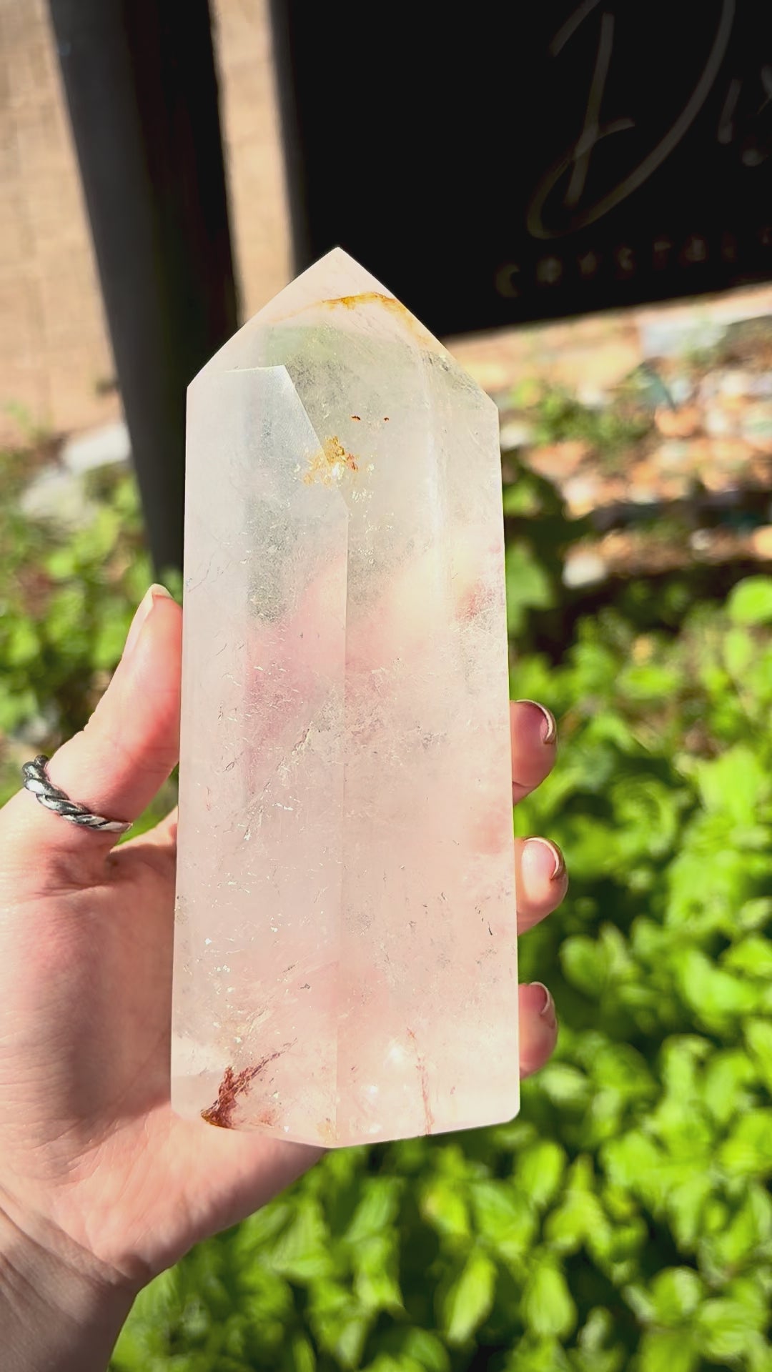 Quartz crystal prism for desk decor with polished finish, clear tones and natural inclusions.