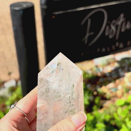 Large polished quartz crystal point from Madagascar with refined shape and natural mineral detail.