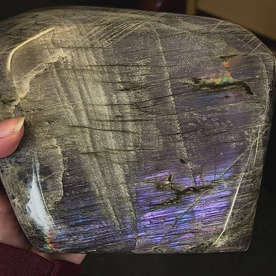 Video showcasing the shifting magenta and purple flash on a Madagascar labradorite freeform.