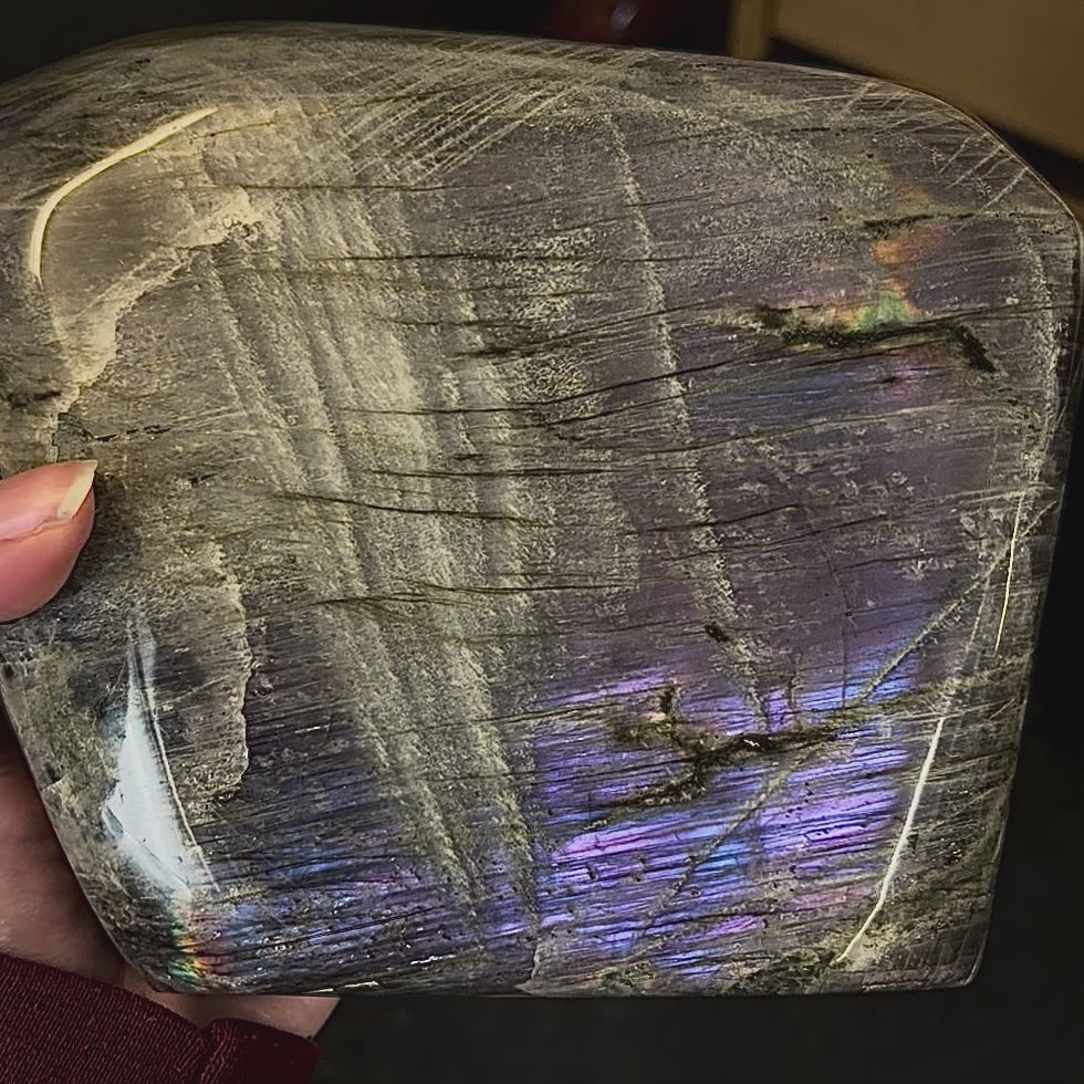 Video showcasing the shifting magenta and purple flash on a Madagascar labradorite freeform.