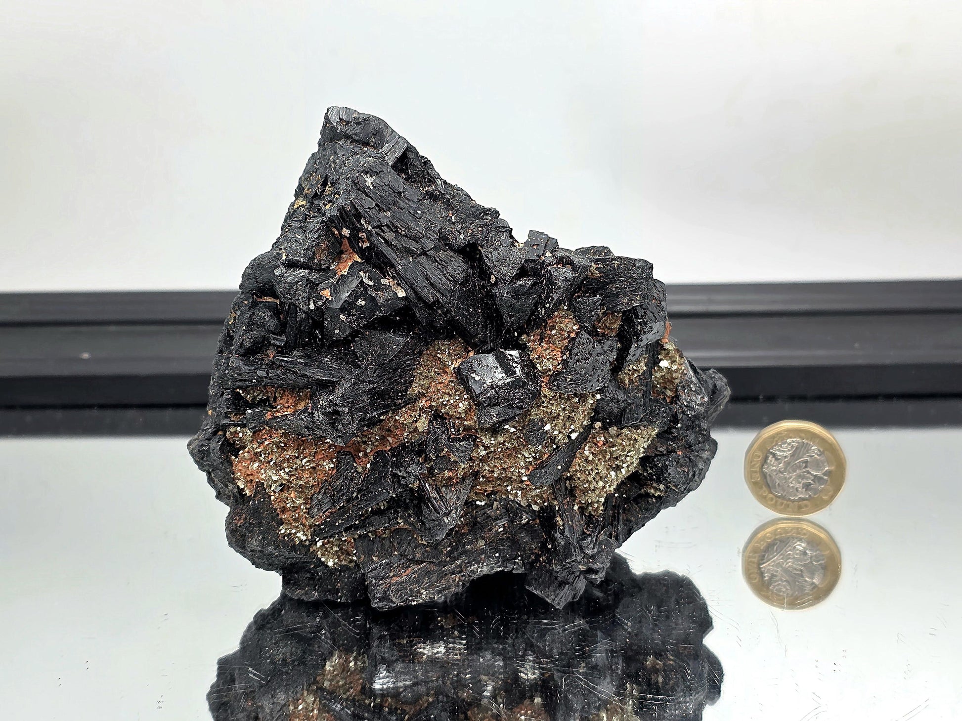 Protective black tourmaline crystal cluster with mica, grounding stone for collectors.