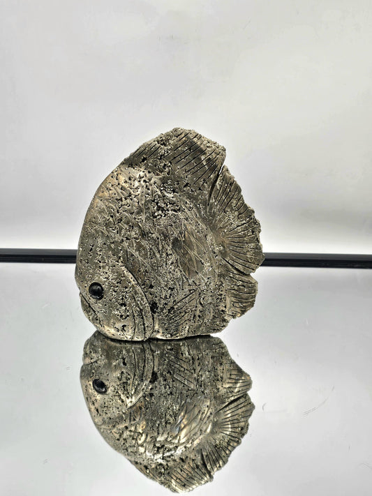 Pyrite Crystal Fish Carving displayed as part of elegant home decor.