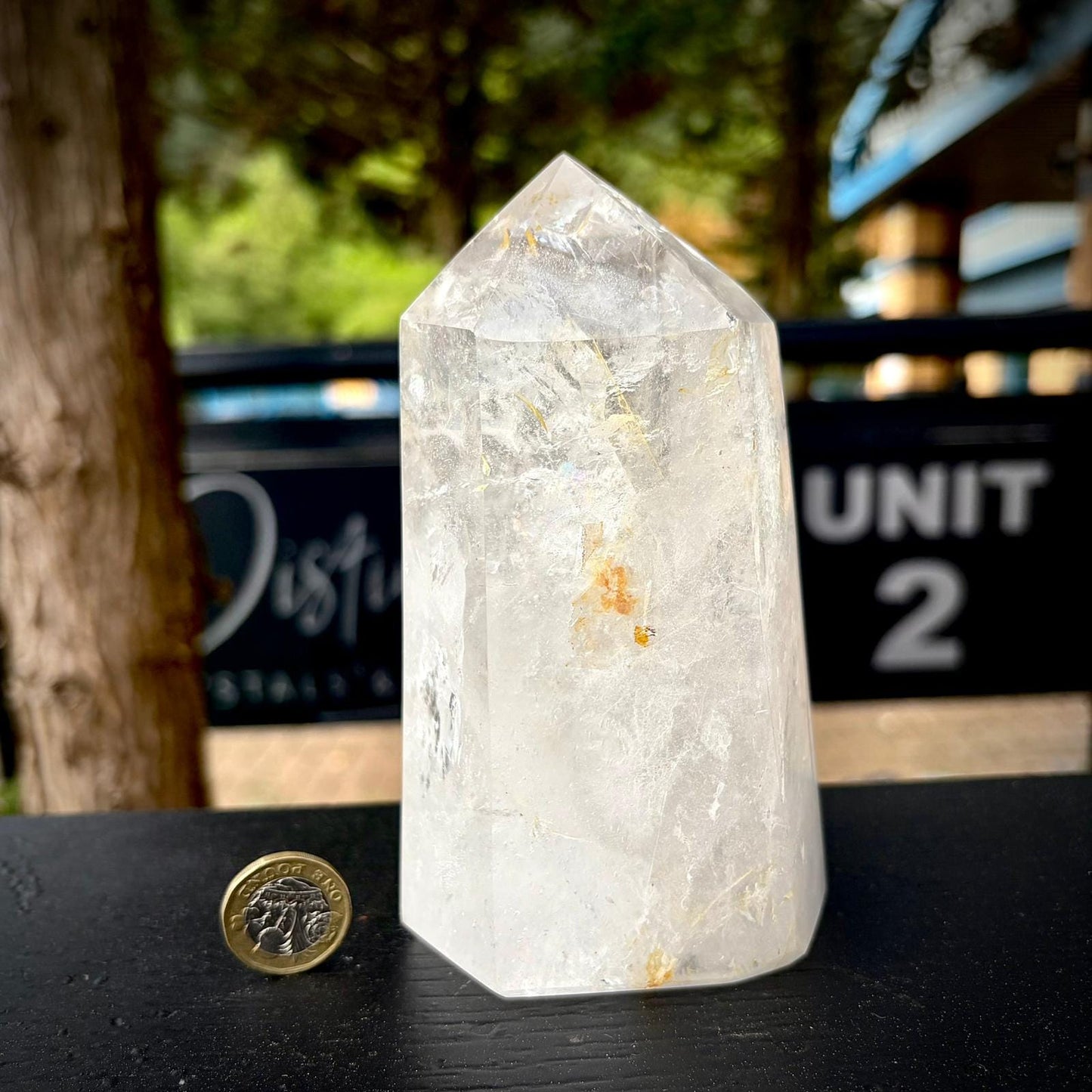 Quartz crystal decor from Madagascar, shaped and polished as a large clear tower.