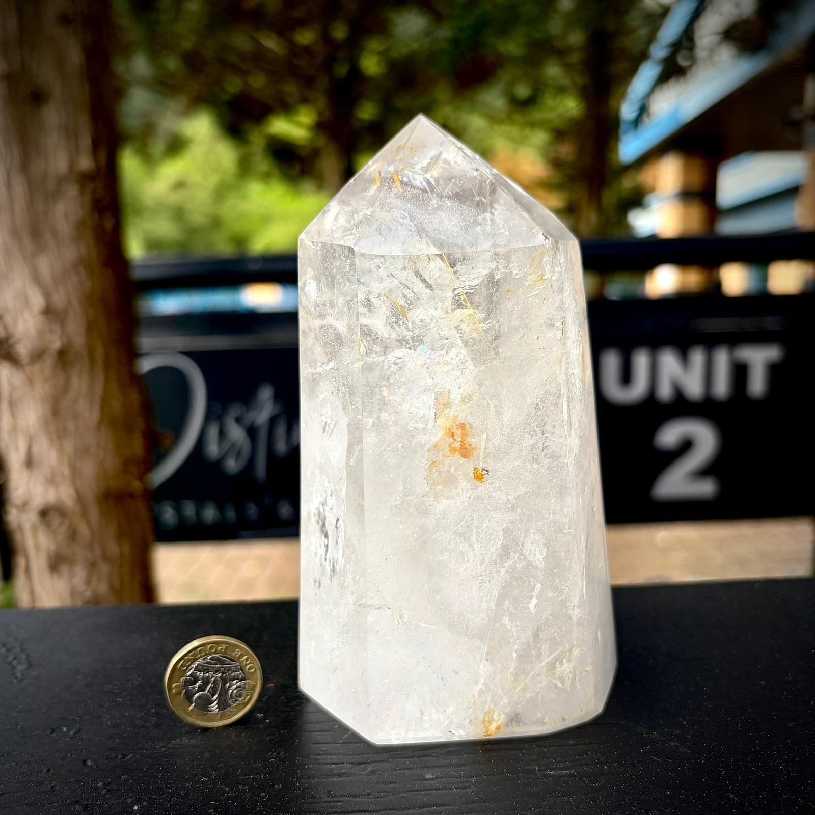 Quartz crystal decor from Madagascar, shaped and polished as a large clear tower.