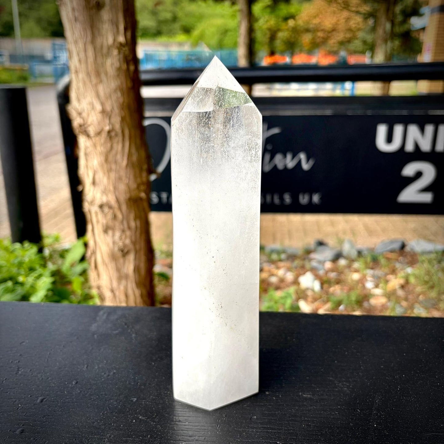 Quartz crystal tower displayed as elegant console table decor for natural interior styling.