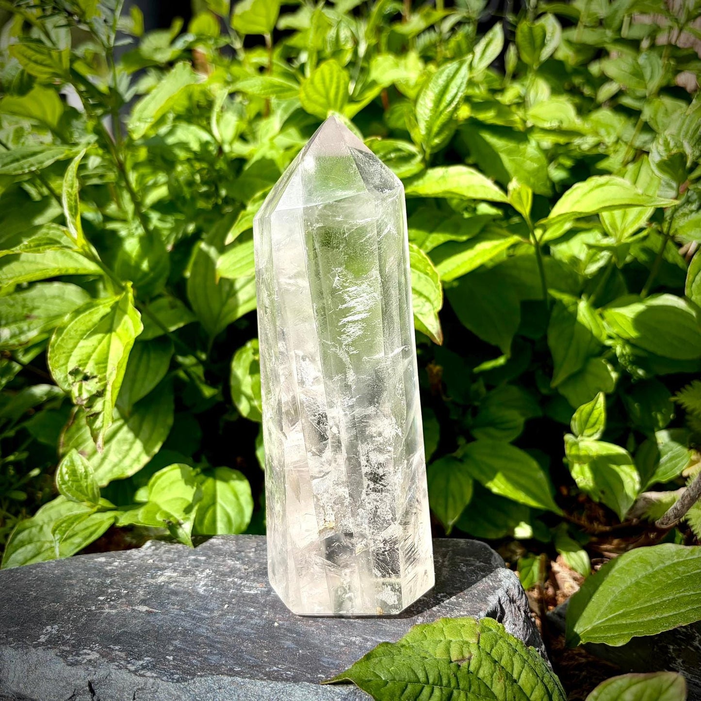 Quartz crystal tower featuring a natural  inclusion and polished prism shape.