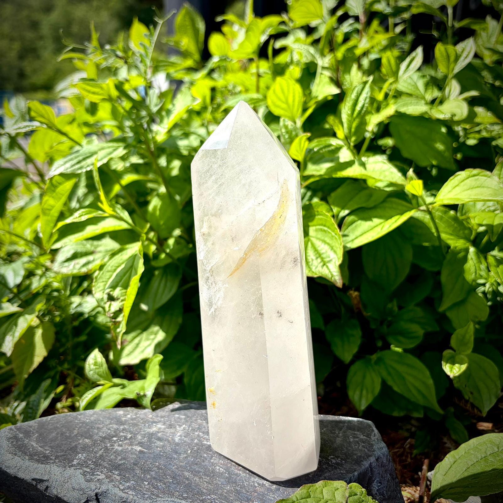 Quartz crystal tower for modern home decor, featuring a tall prism shape and polished finish.