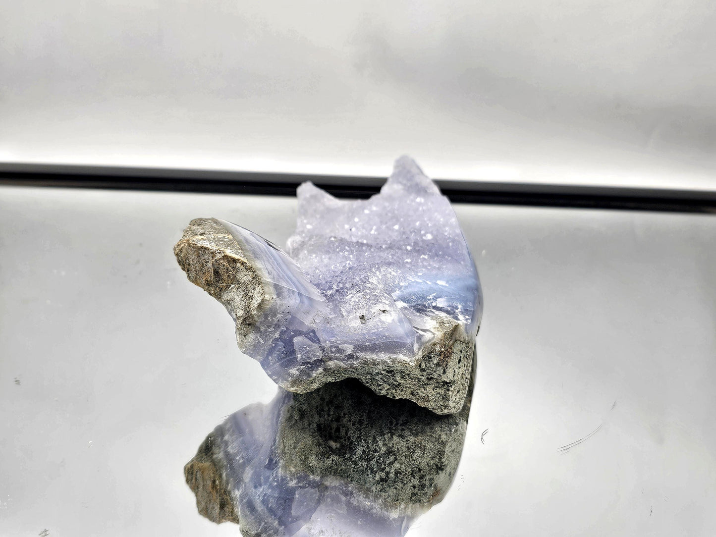 Blue Lace Agate geode with Quartz druzy, a stunning decor piece for contemporary interiors.