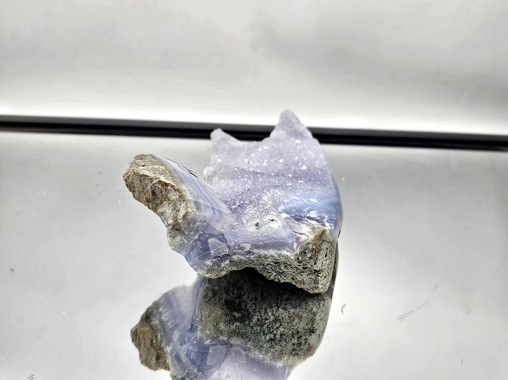 Blue Lace Agate geode with Quartz druzy, a stunning decor piece for contemporary interiors.