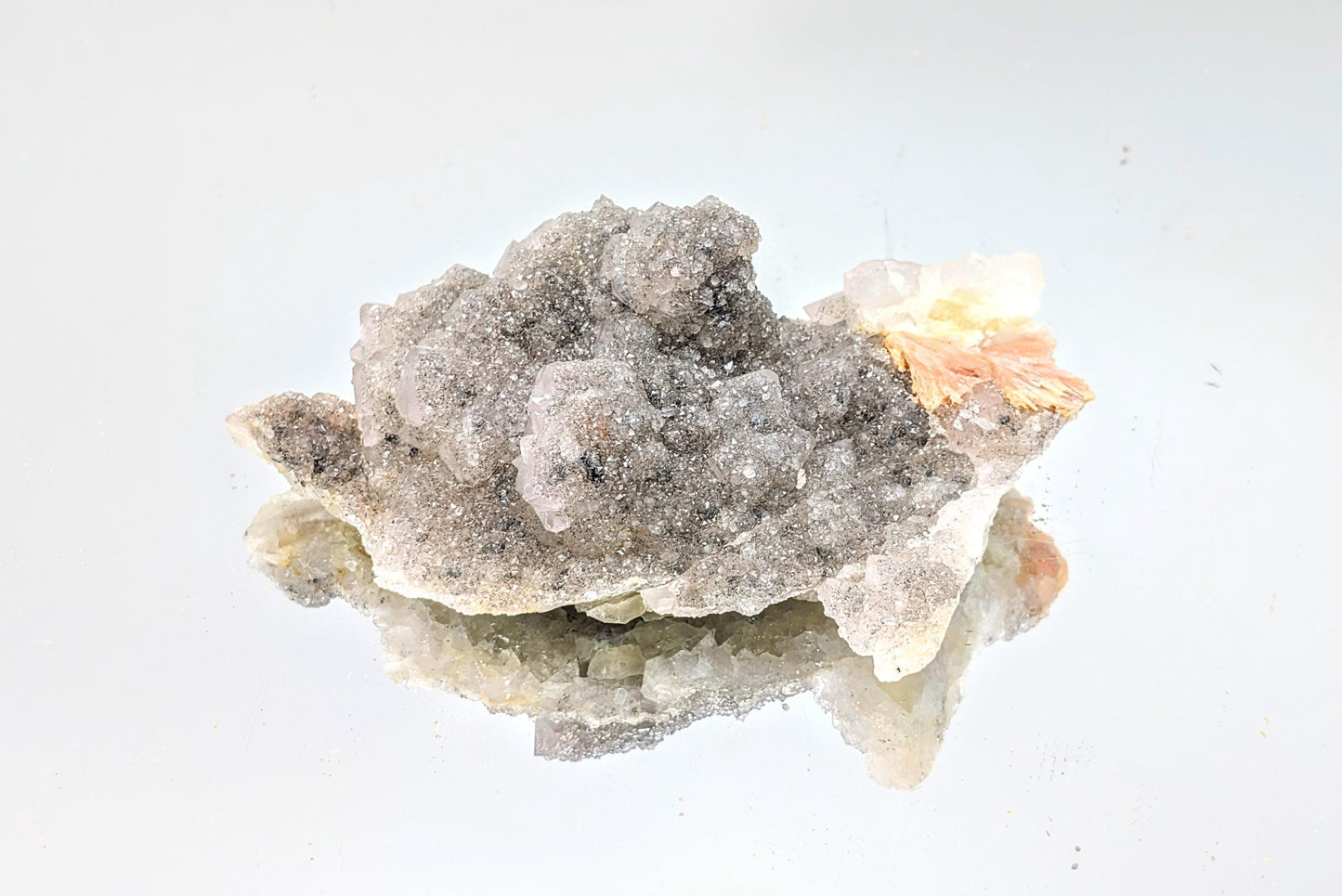 Quartz on Fluorite crystal with UV fluorescence, perfect for collectors.