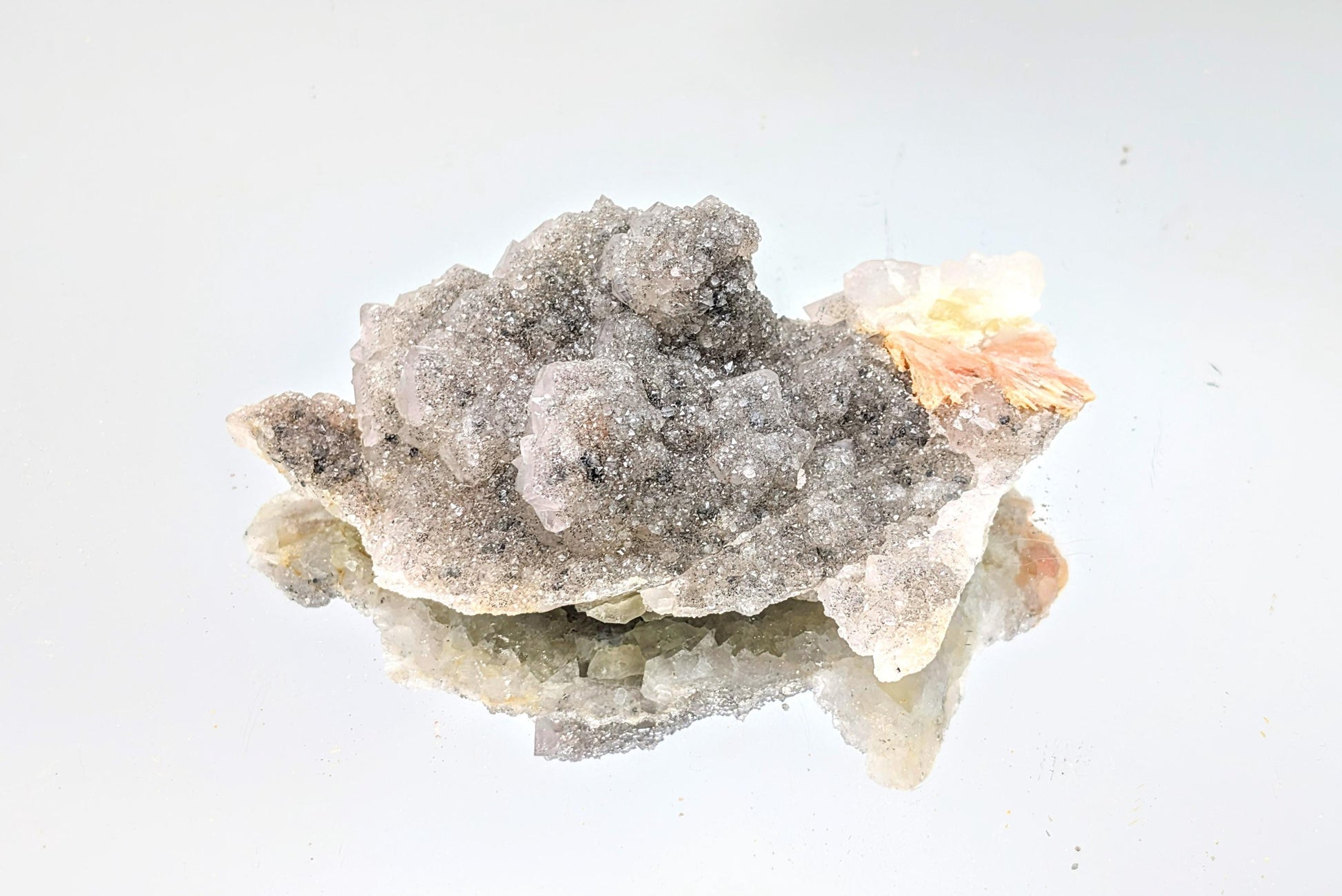 Quartz on Fluorite crystal with UV fluorescence, perfect for collectors.