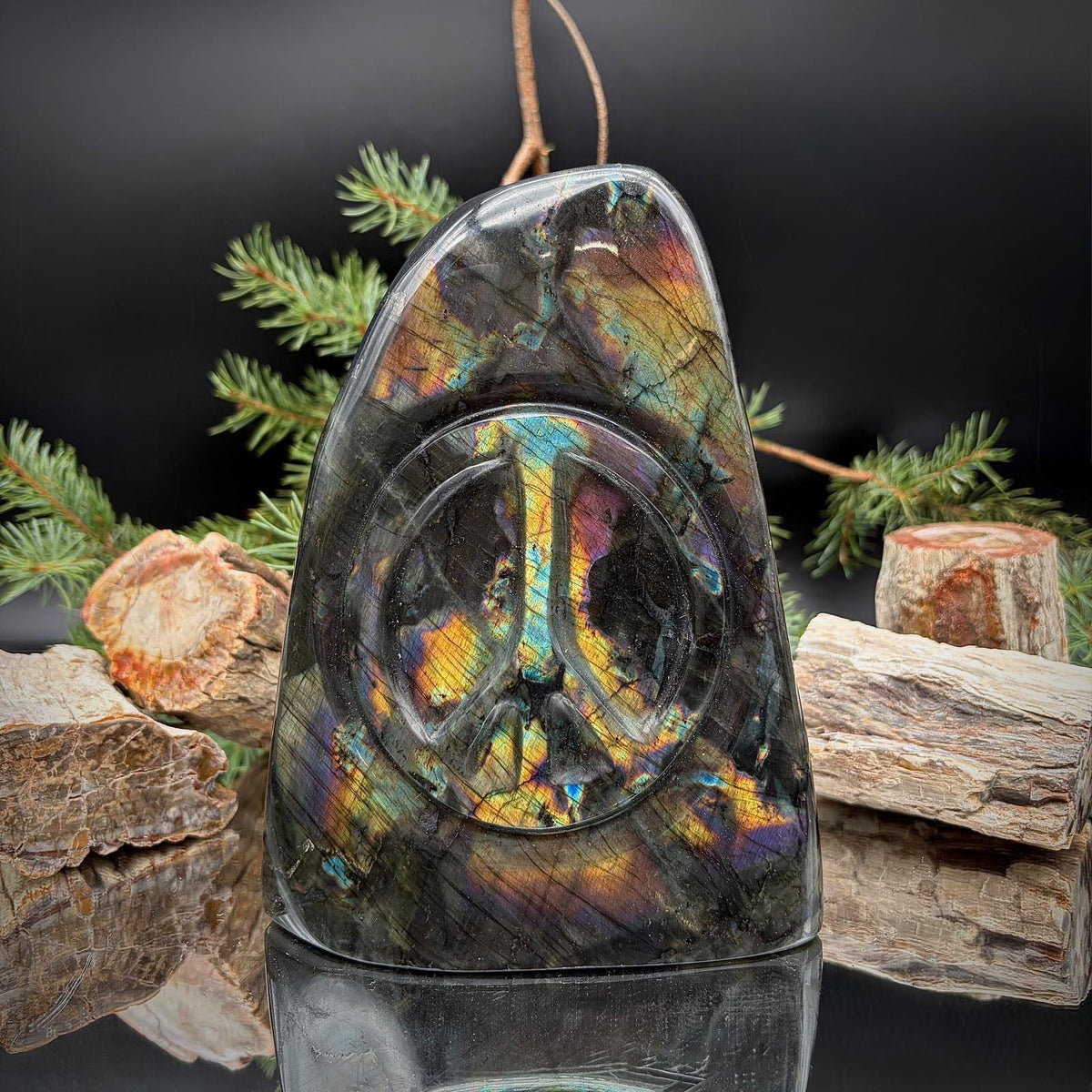 Large Rainbow Labradorite Peace Sign crystal carving from Madagascar, displaying vibrant natural multicoloured labradorescence.