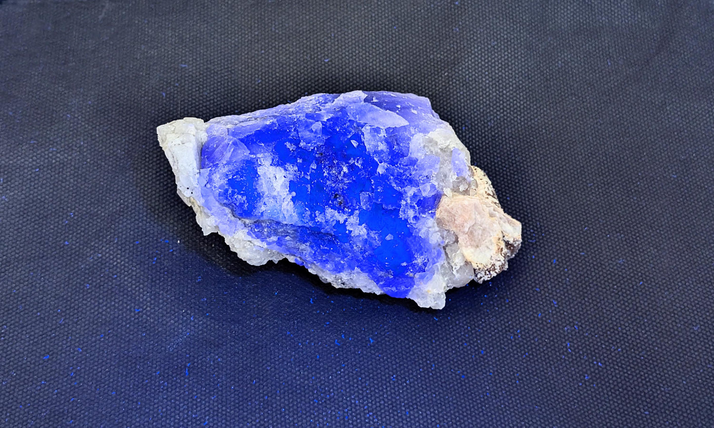 Rare Quartz on Fluorite specimen with intricate formations.