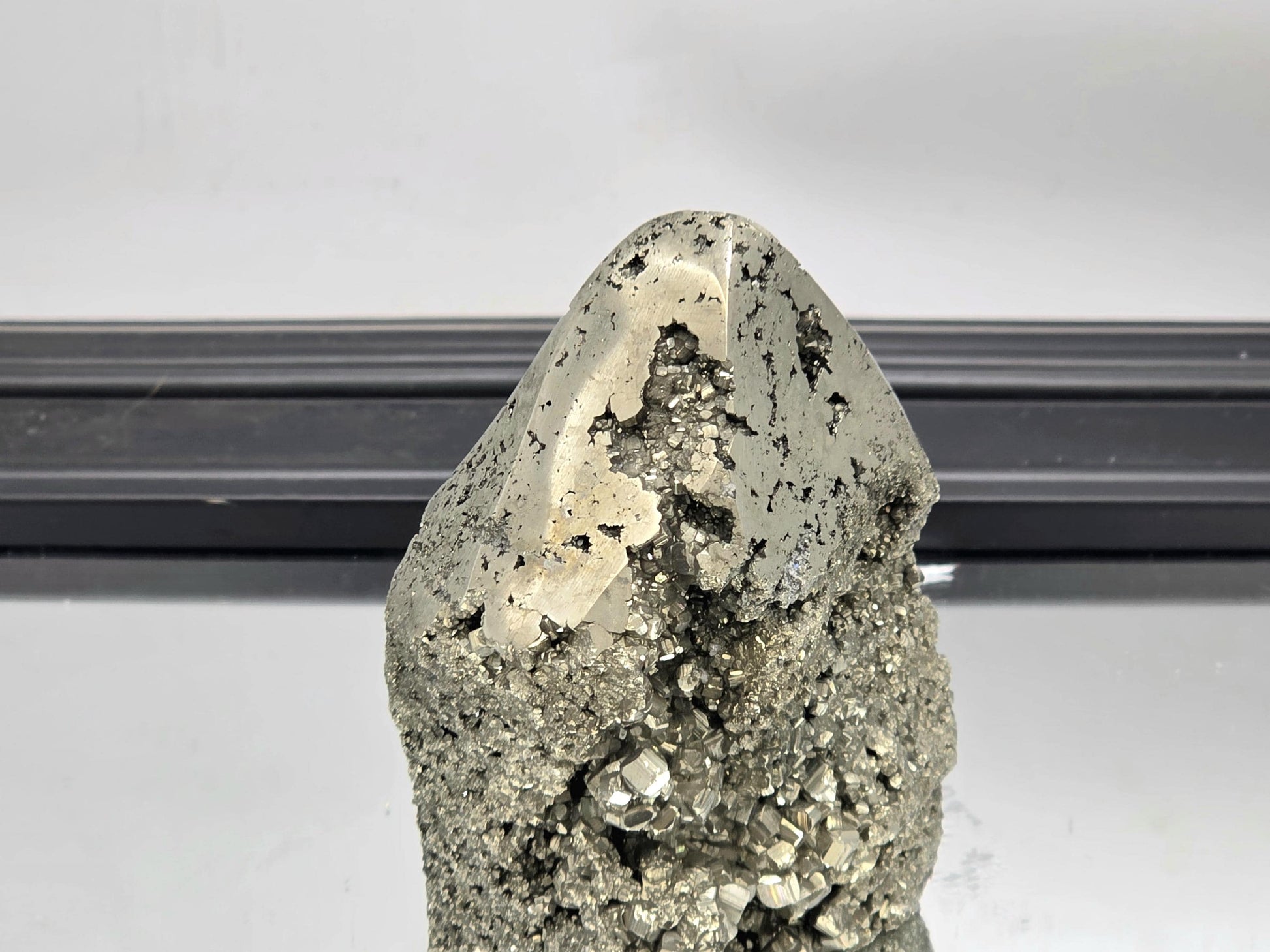 Pyrite tower blending raw texture with smooth crystal polish.