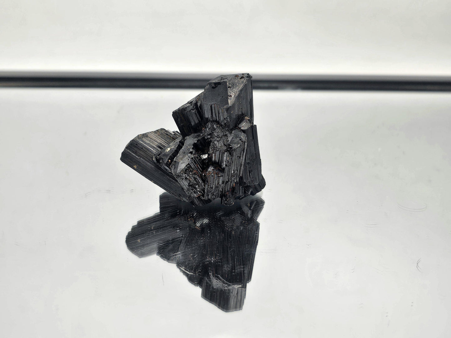 Raw, unpolished Black Tourmaline crystal with natural termination, sourced from Madagascar.