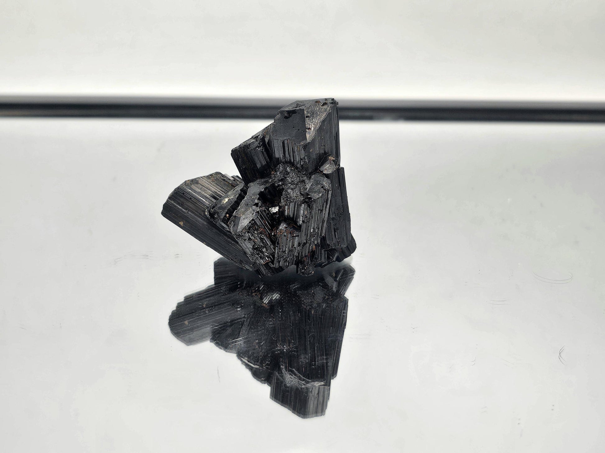 Raw, unpolished Black Tourmaline crystal with natural termination, sourced from Madagascar.