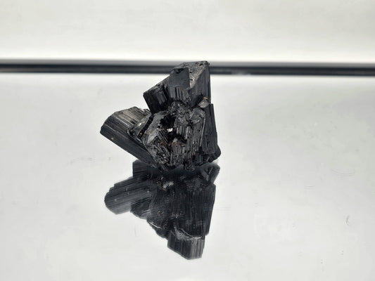 Raw, unpolished Black Tourmaline crystal with natural termination, sourced from Madagascar.