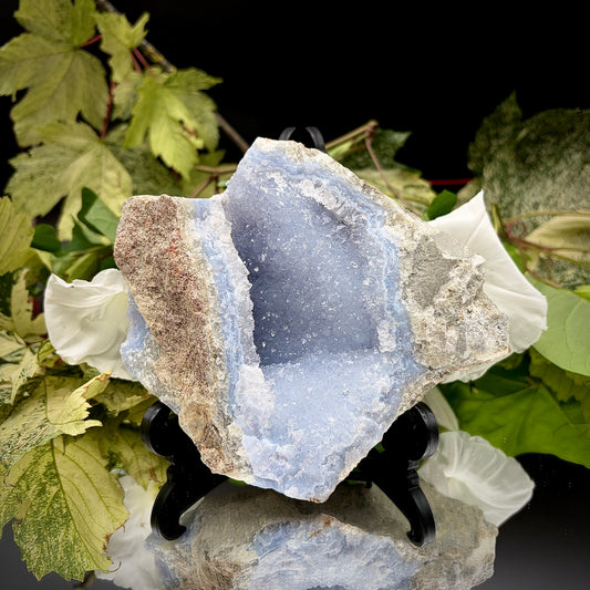 Natural Blue Lace Agate geode specimen with a prominent hollow cavity showing off light blue crystalline bands.