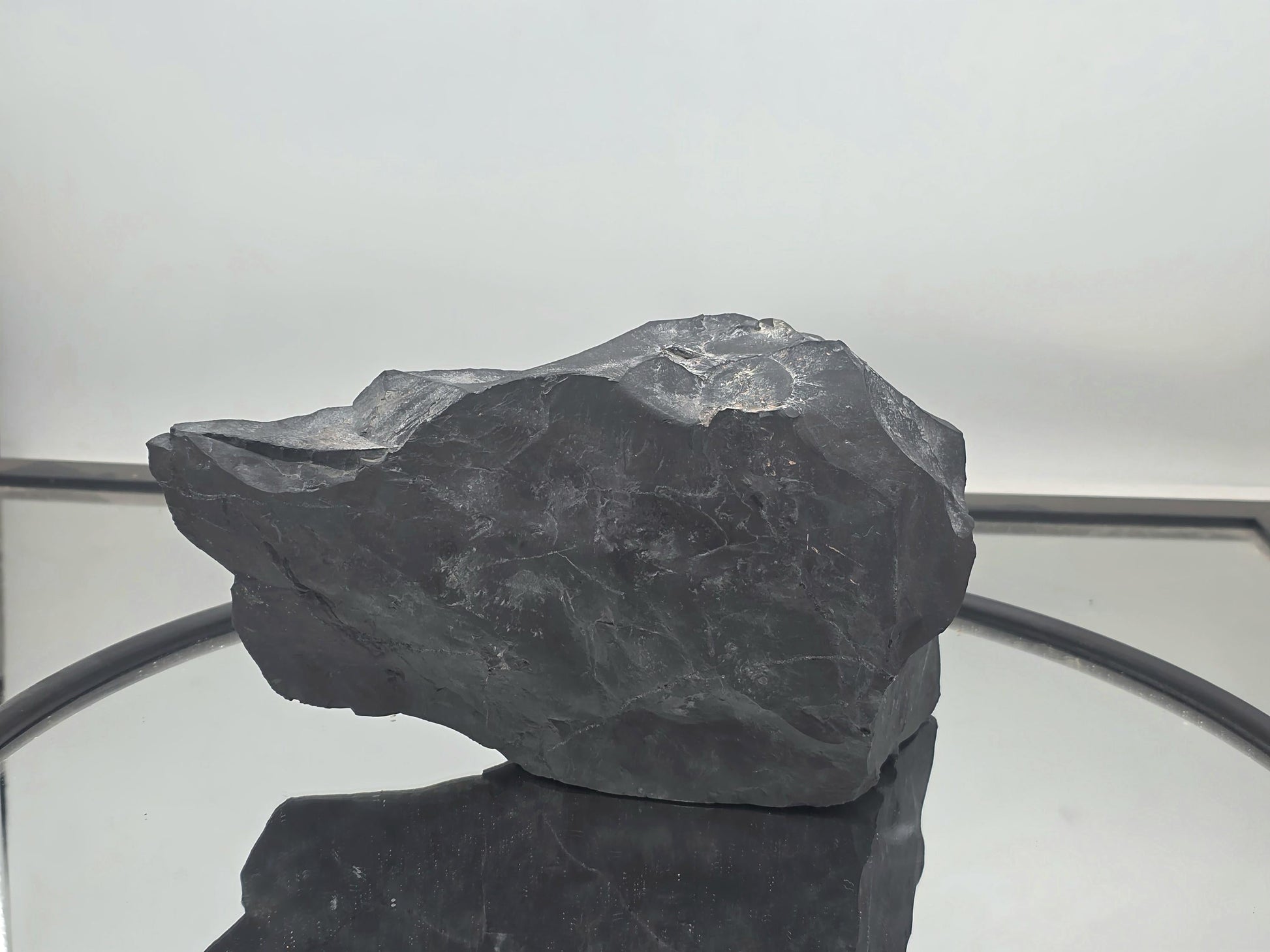 Decorative shungite piece with natural and polished surfaces.