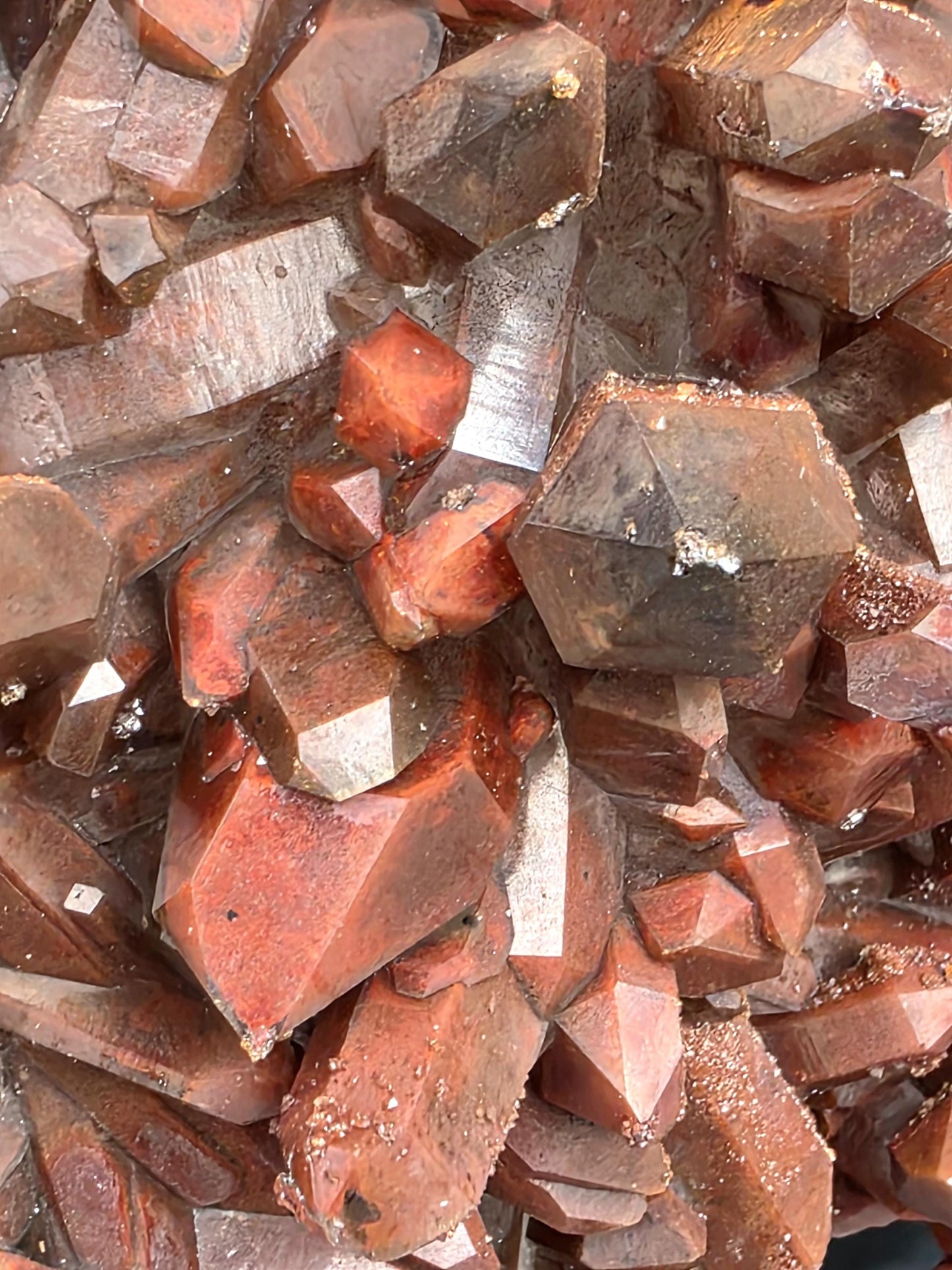 Close-up of red Hematite inclusions in Quartz cluster