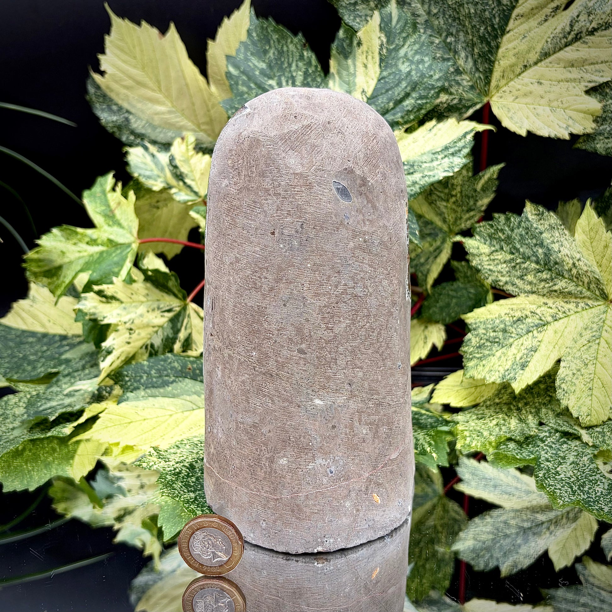Reverse side of an Uruguayan amethyst crystal freeform showing the matrix and mineral formation.