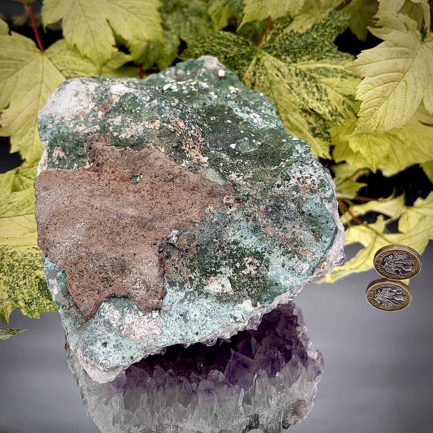 Reverse side of a natural amethyst crystal cluster showing the matrix and mineral formation.