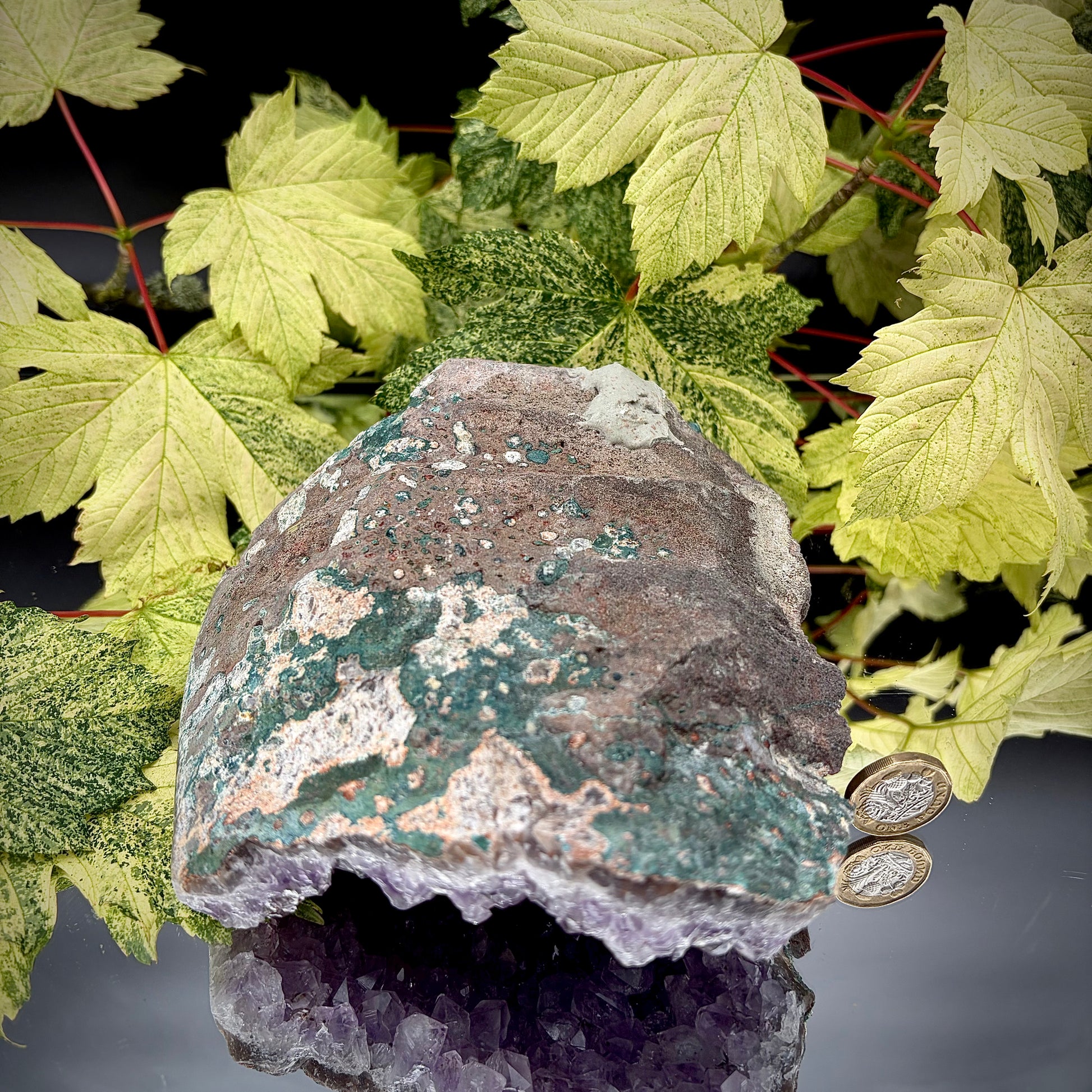 Reverse side of a natural amethyst crystal cluster showing the matrix and mineral formation.