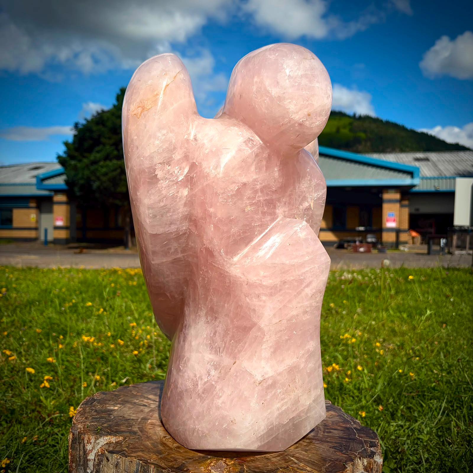 Madagascan Rose Quartz angel styled as an elegant crystal feature for a luxury home interior.