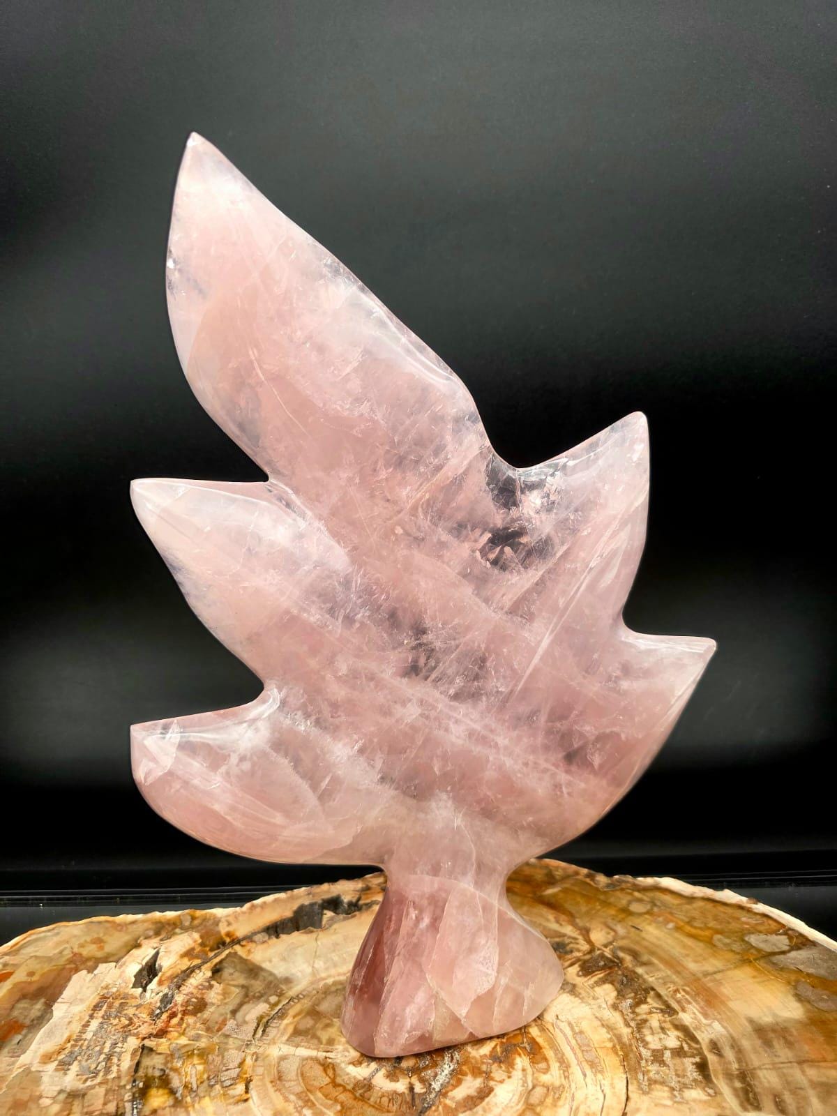 Front view of a hand-carved Rose Quartz botanical leaf sculpture from Madagascar.
