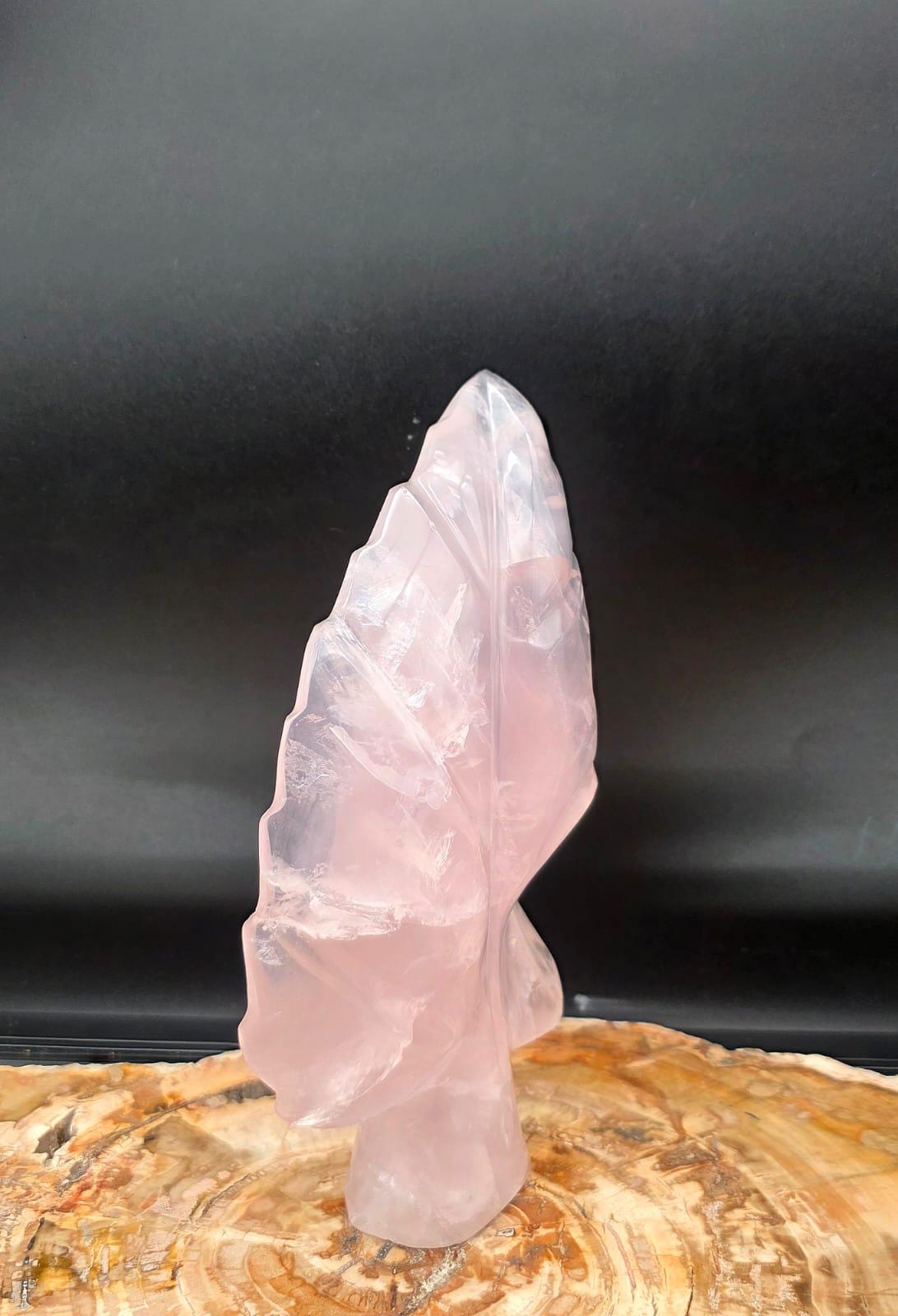 Genuine Rose Quartz leaf sculpture displaying soft blush pink tones and elegant botanical styling.