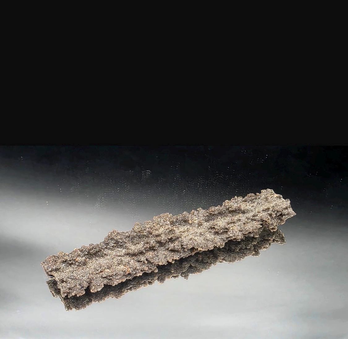 Natural Fulgurite specimen originating from the Sahara Desert in Algeria.