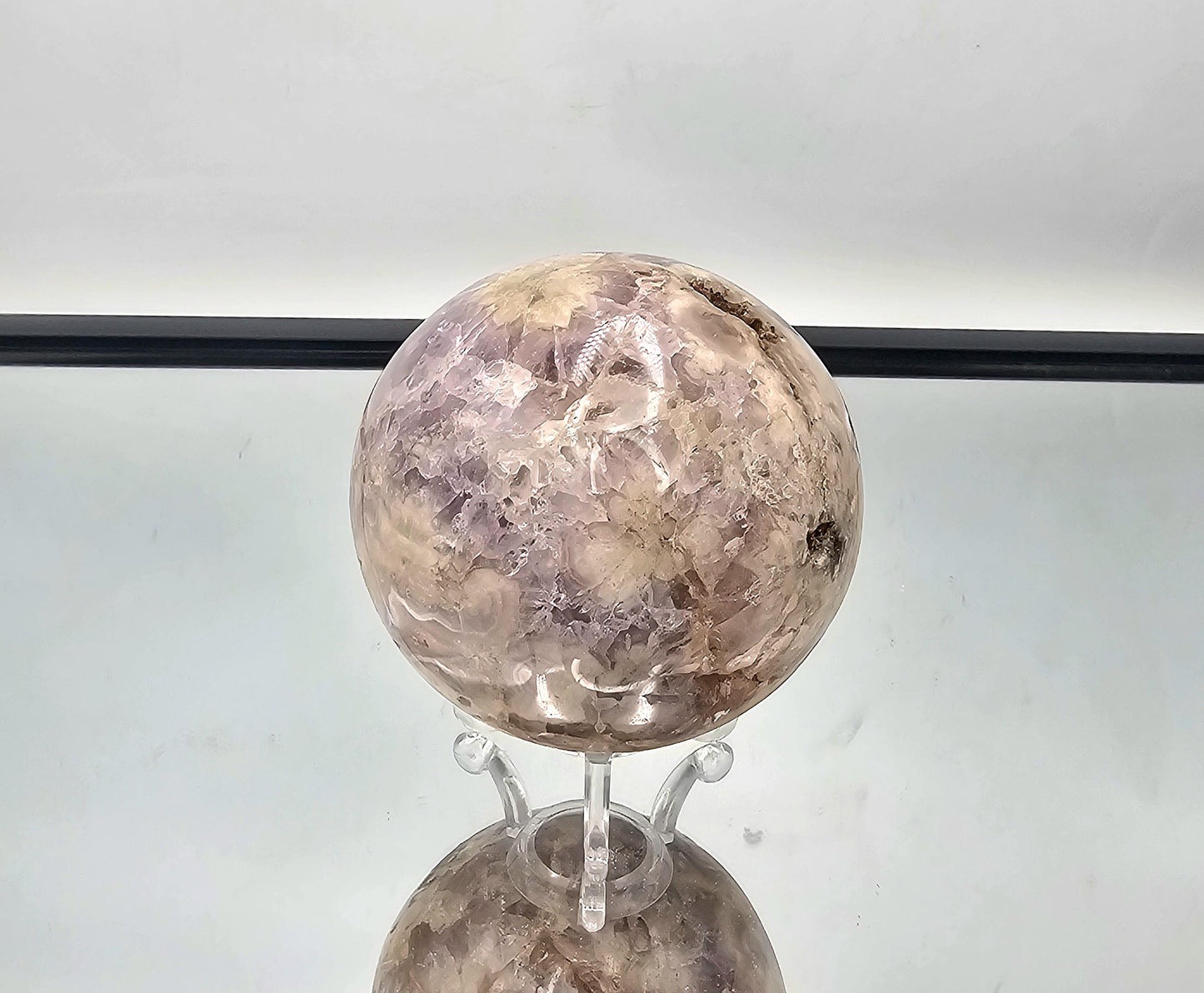 Detailed view of the Sakura Agate and Amethyst sphere with intricate flower-like formations.