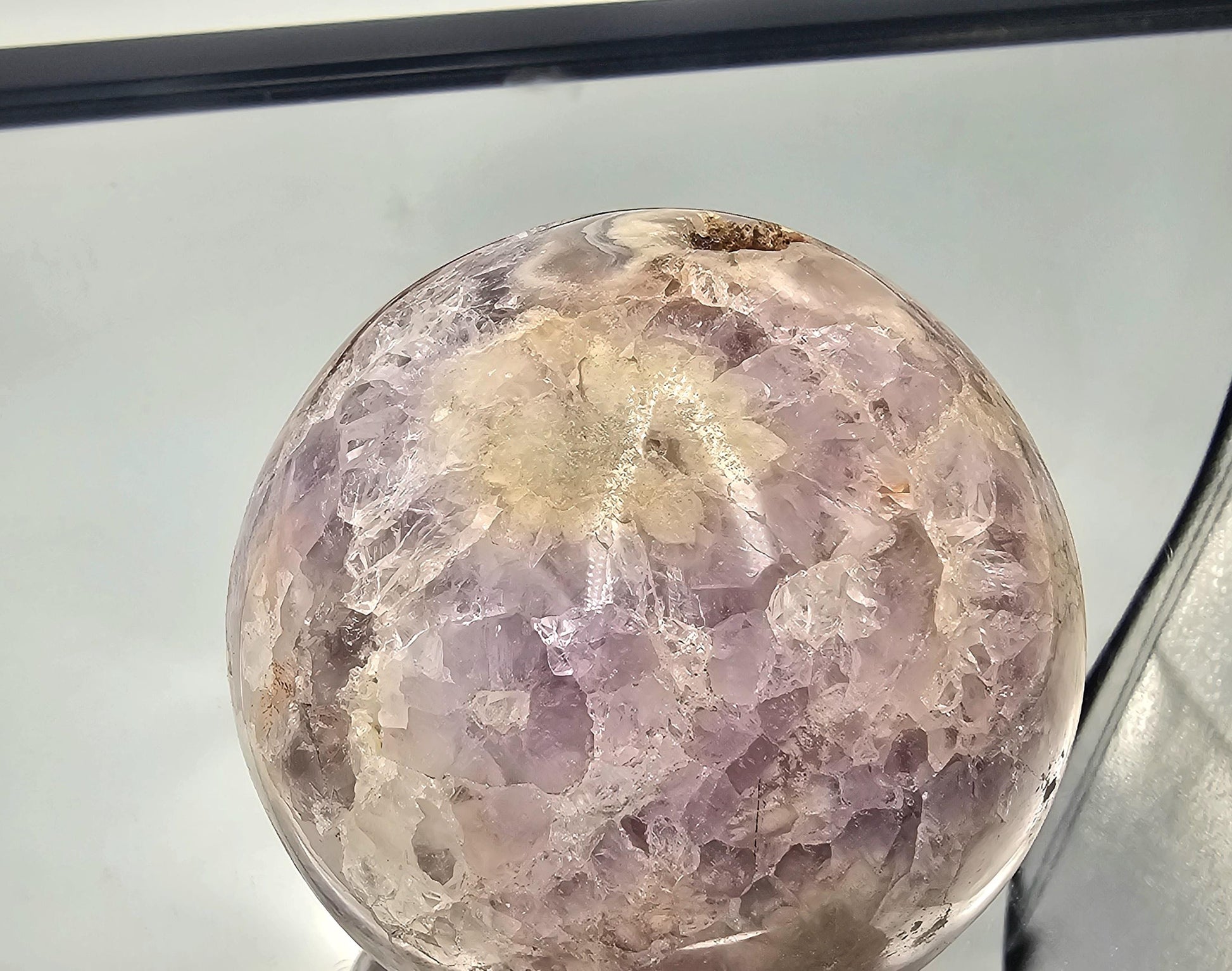  Amethyst and Sakura Agate sphere with floral-like patterns, showcasing its natural beauty.