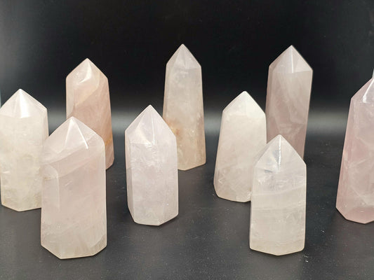 Small Rose Quartz tower, a delicate crystal point for home décor.
