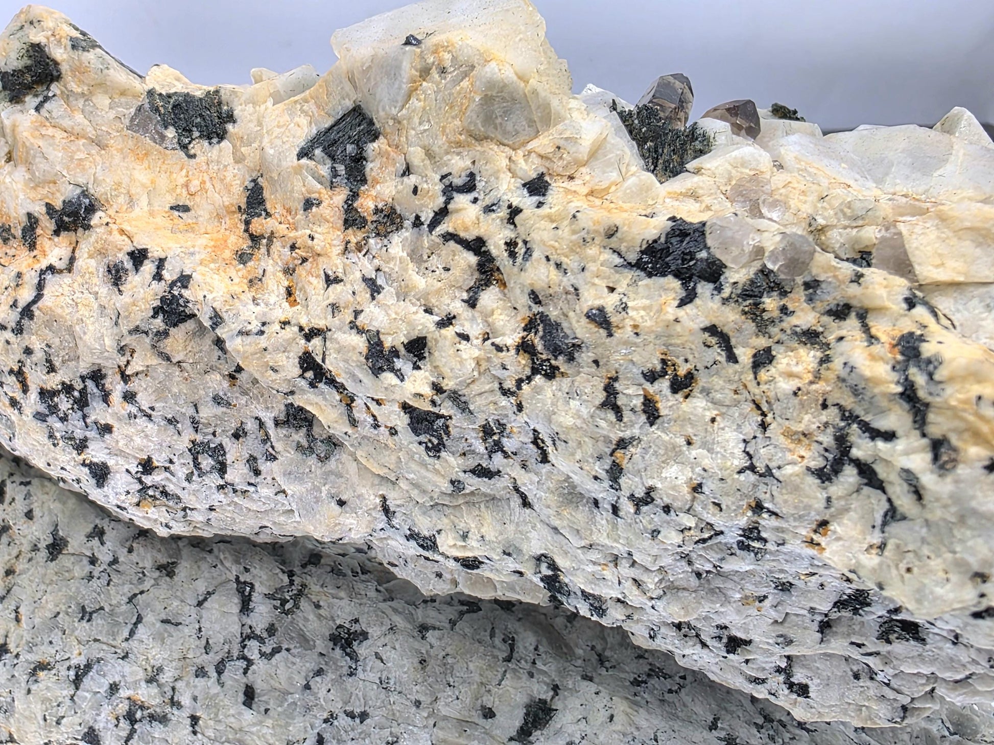 Cluster of sharply formed Aegirine and Quartz crystals.