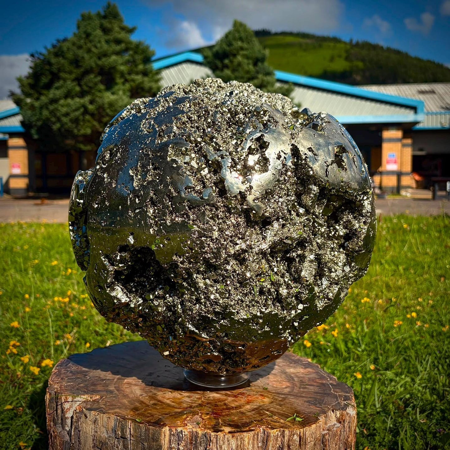 Statement Pyrite sculpture with reflective metallic surfaces for a refined home interior.