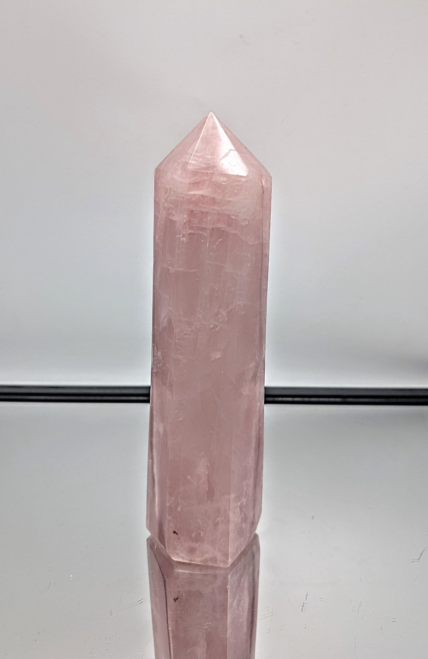Statement hand-polished rose quartz prism, perfect for home interiors.