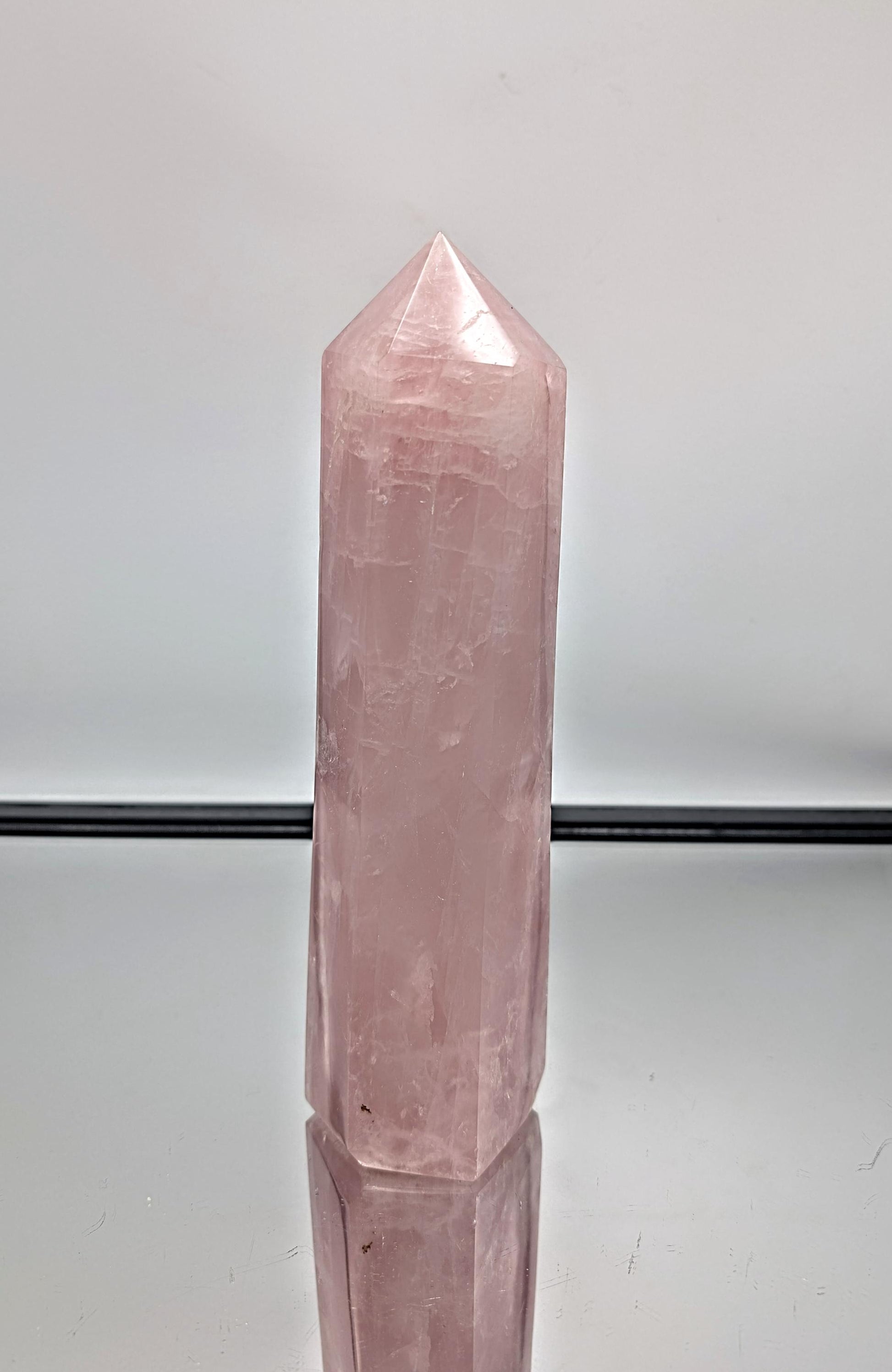 Statement hand-polished rose quartz prism, perfect for home interiors.