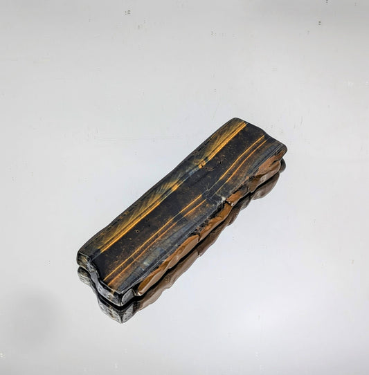 Display-ready Tiger’s Eye slice with smooth finish.