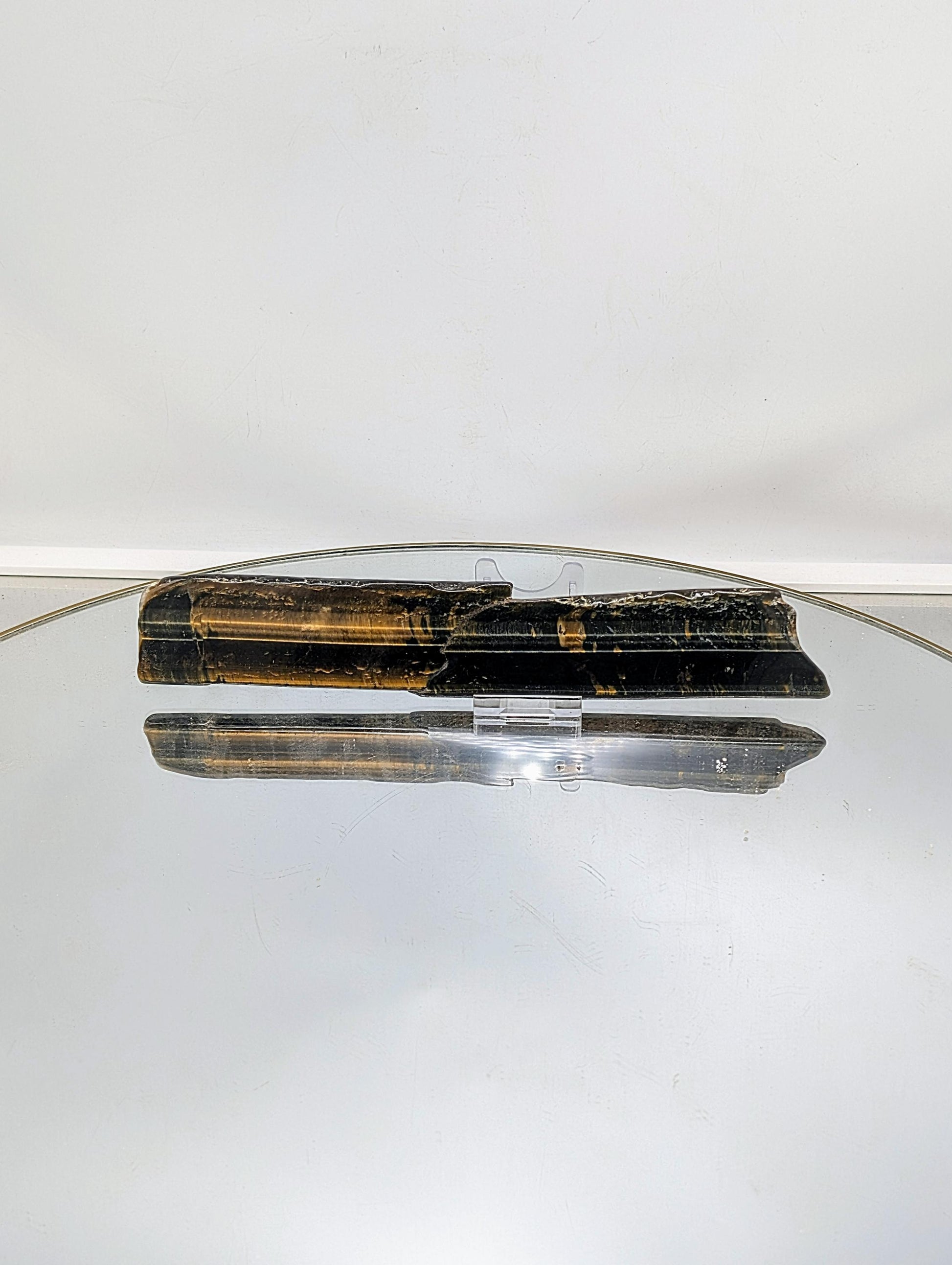  Polished Tiger’s Eye slice with a smooth surface