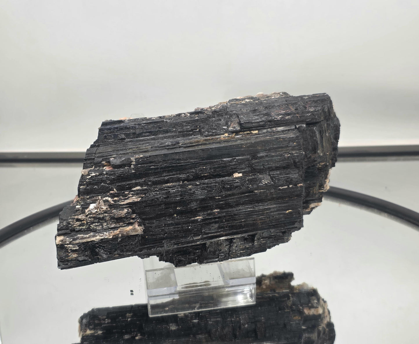 Unique mineral specimen combining black tourmaline and mica.