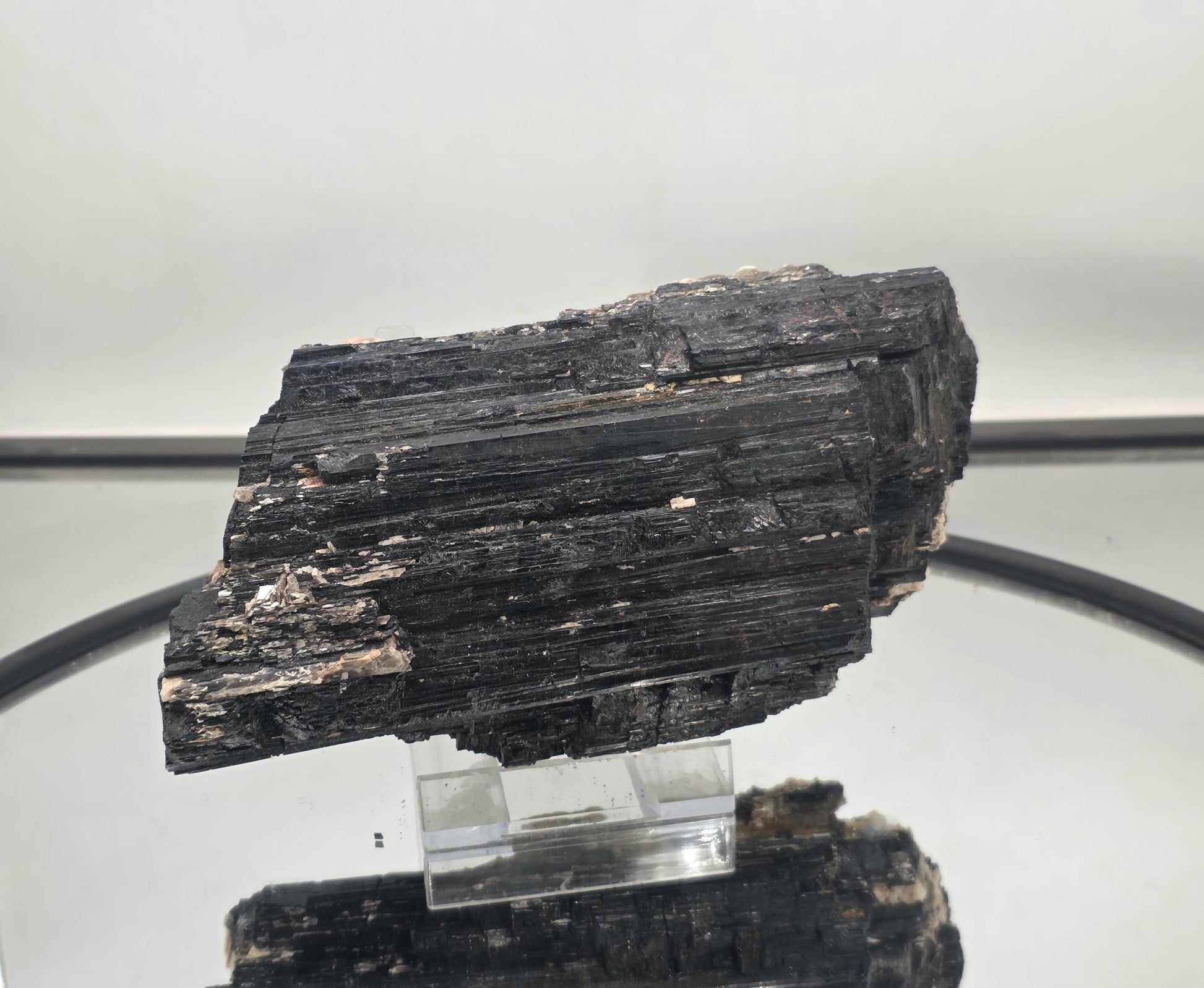 Unique mineral specimen combining black tourmaline and mica.
