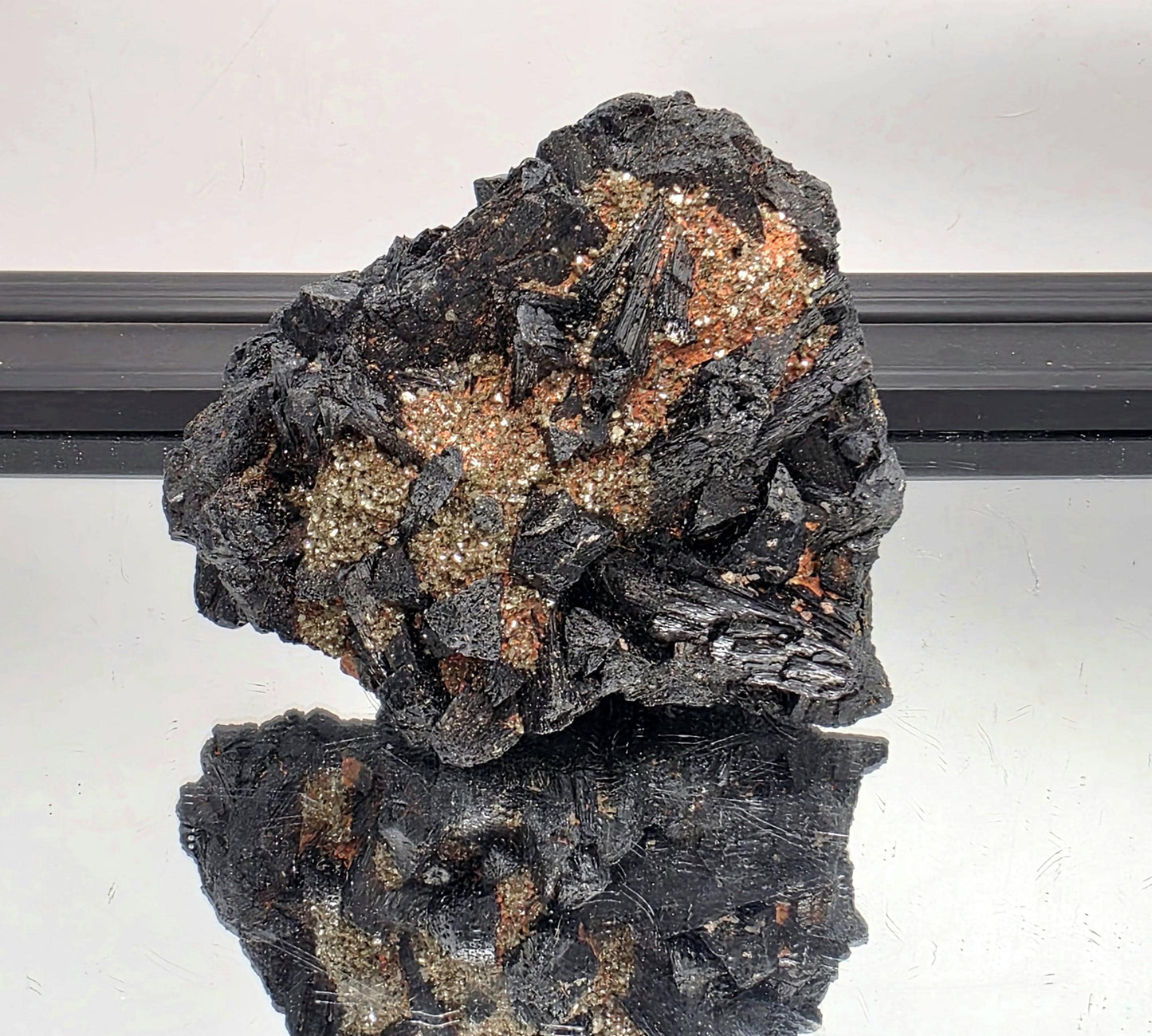 Black tourmaline crystal cluster with mica, raw mineral display piece.