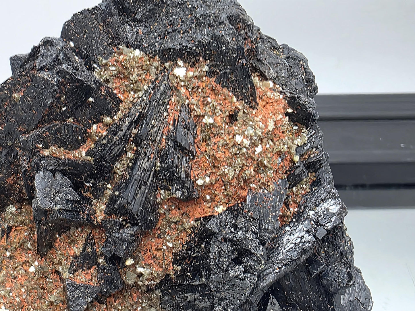 Black tourmaline cluster with mica, natural raw crystal specimen.
