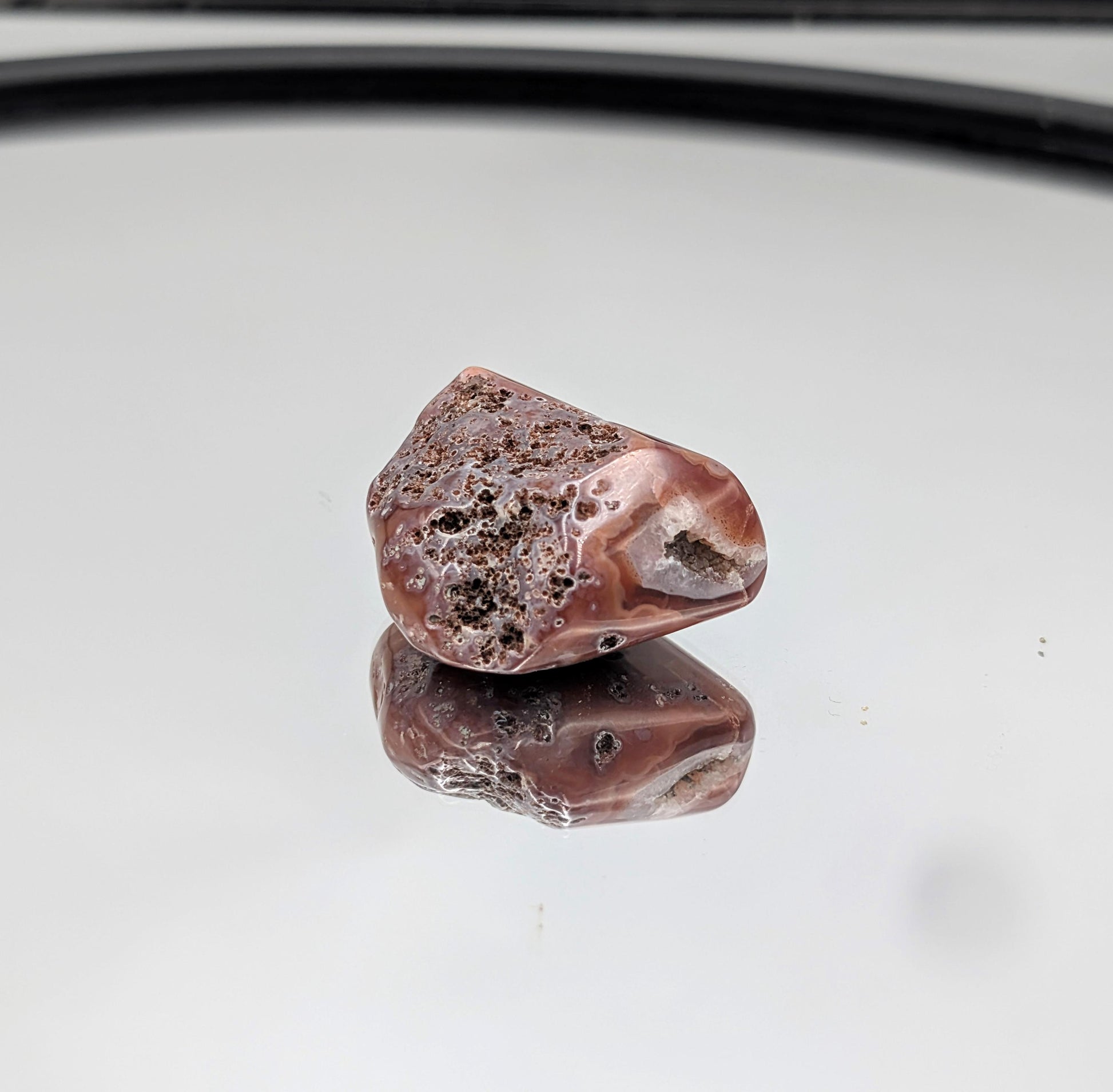 Unique banded Malawi Agate tumbled crystal with natural charm.