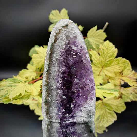 Detailed view of a natural Uruguayan Amethyst geode showing its individual purple quartz crystal formations.
