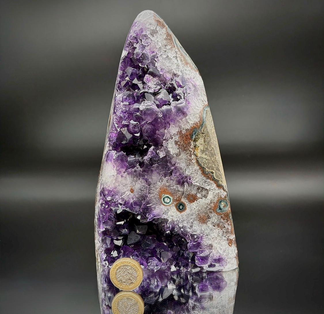 Natural Uruguayan Amethyst mineral in freeform shape.