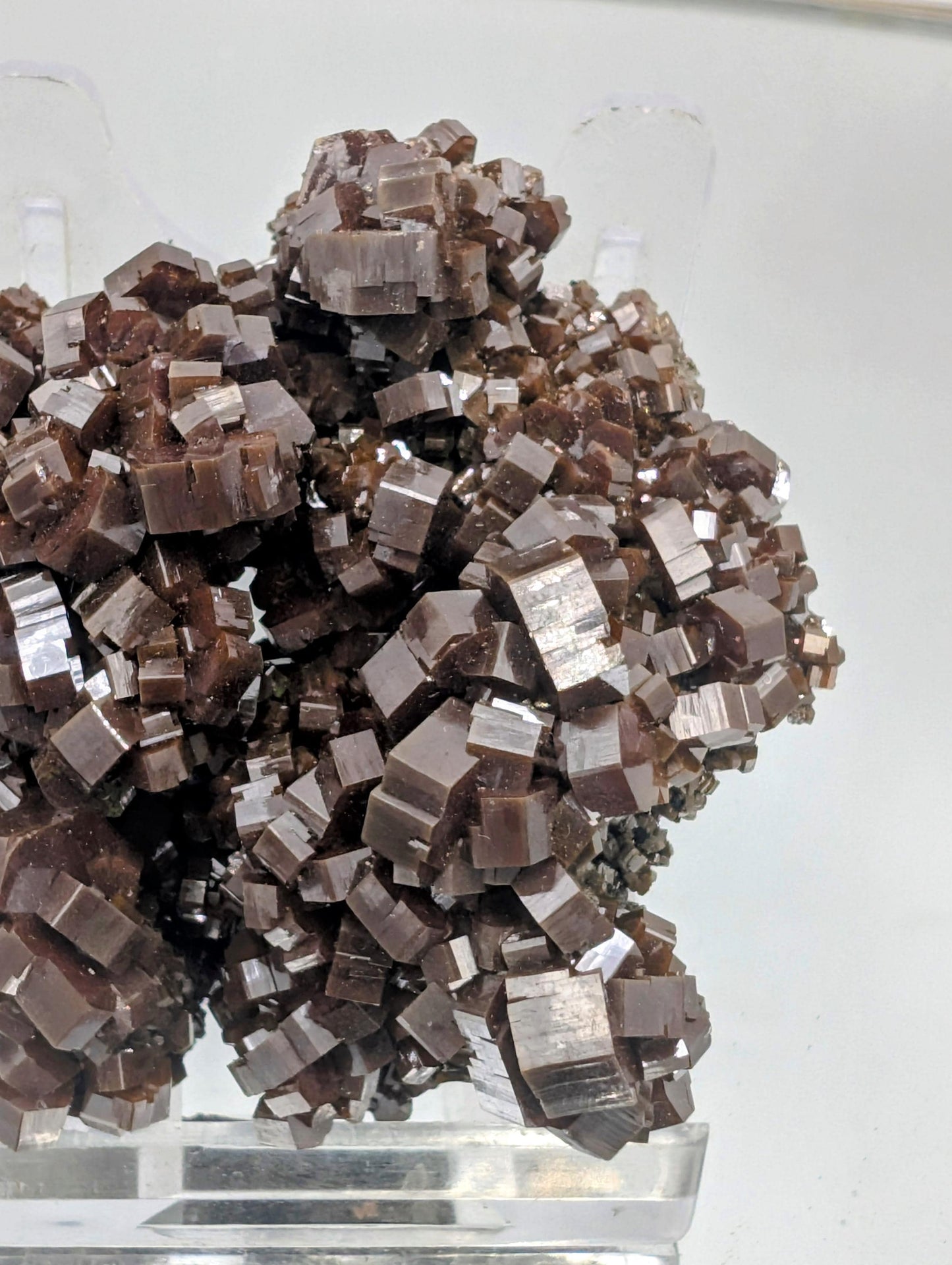 Vanadinite mineral cluster with intense red hexagonal crystals