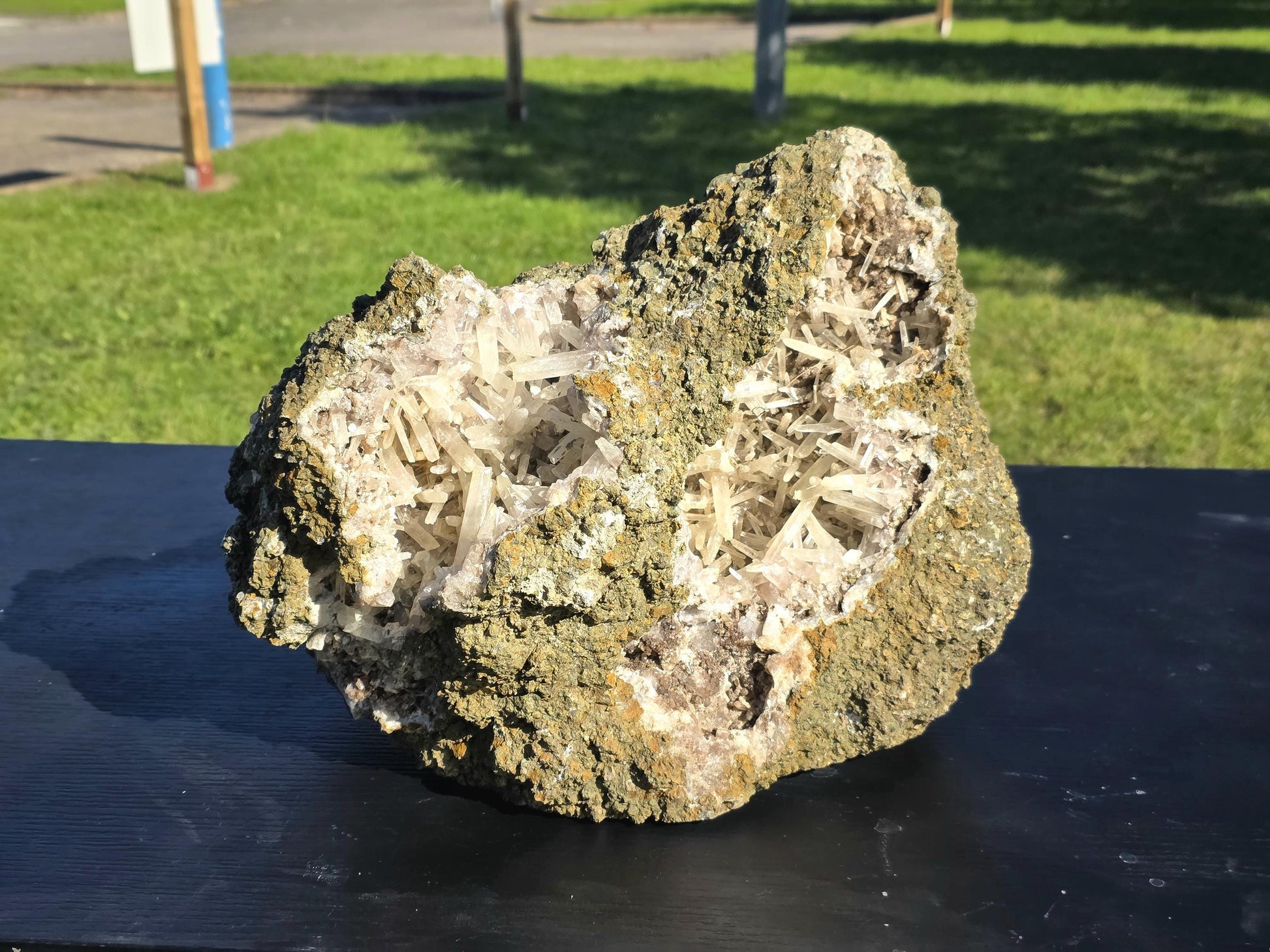 Very large Moroccan Aragonite geode showcasing striking natural crystal formations.